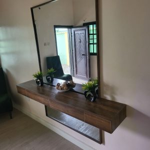 Console with mirror in a living room from Winnys Interiors
