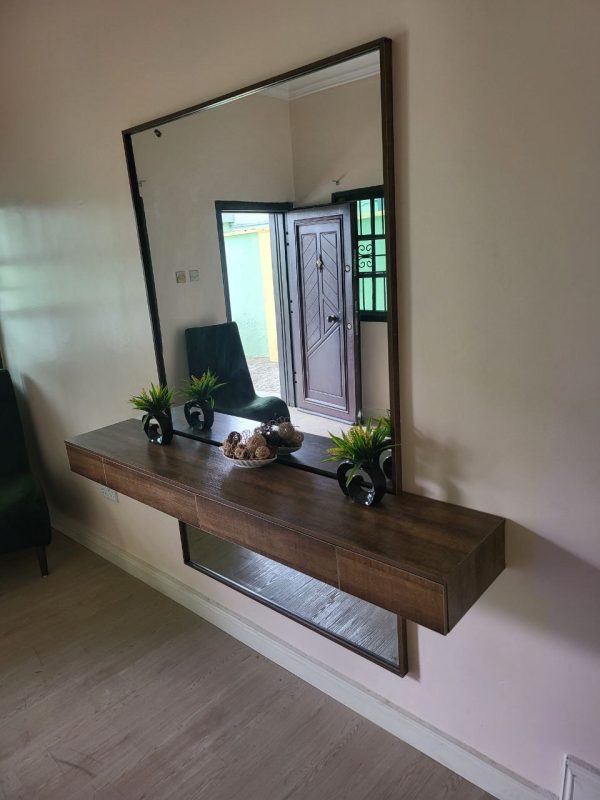 Console with mirror in a living room from Winnys Interiors