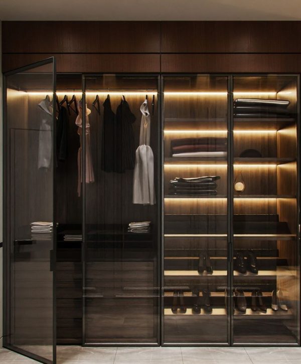 Customizable wardrobes with HDF wood, aluminum profiles, glass, and LED profiles in a bedroom from Winnyz Interiors