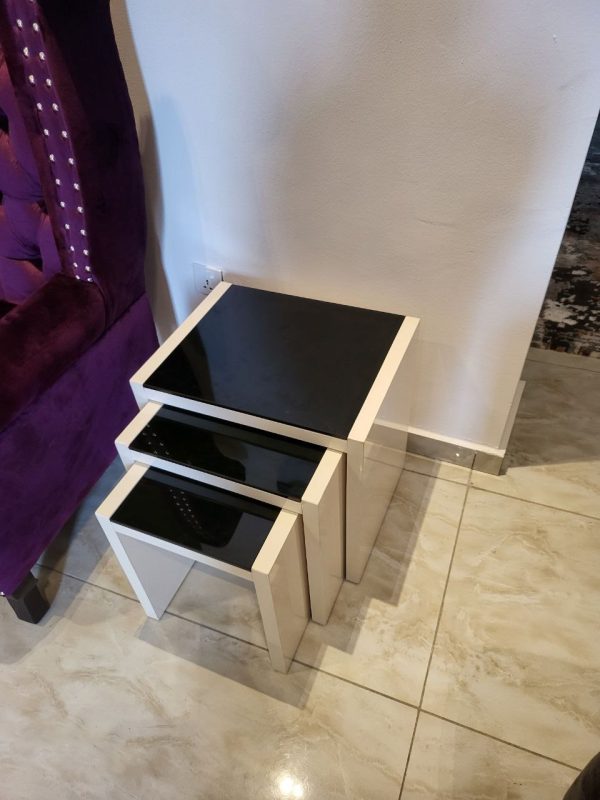 Nest of stools used as side tables in a living room from Winnyz Interiors