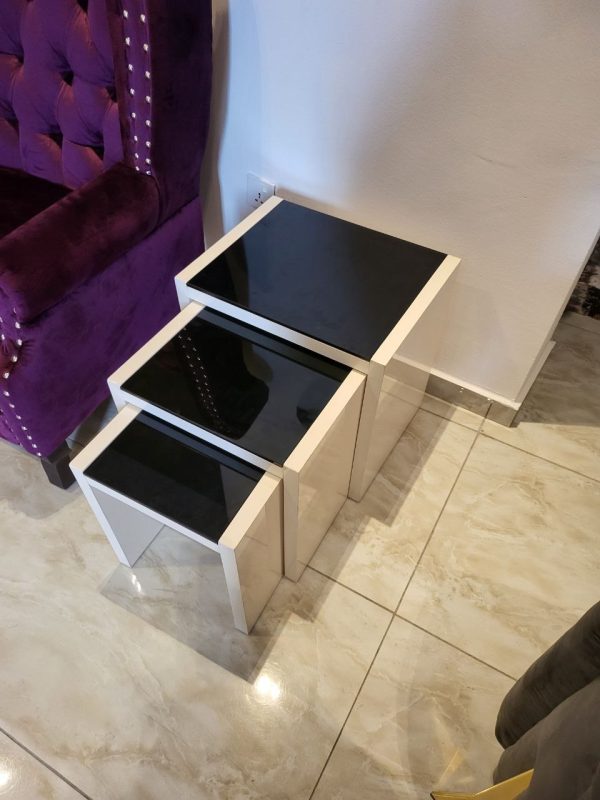 Nest of stools used as side tables in a living room from Winnyz Interiors